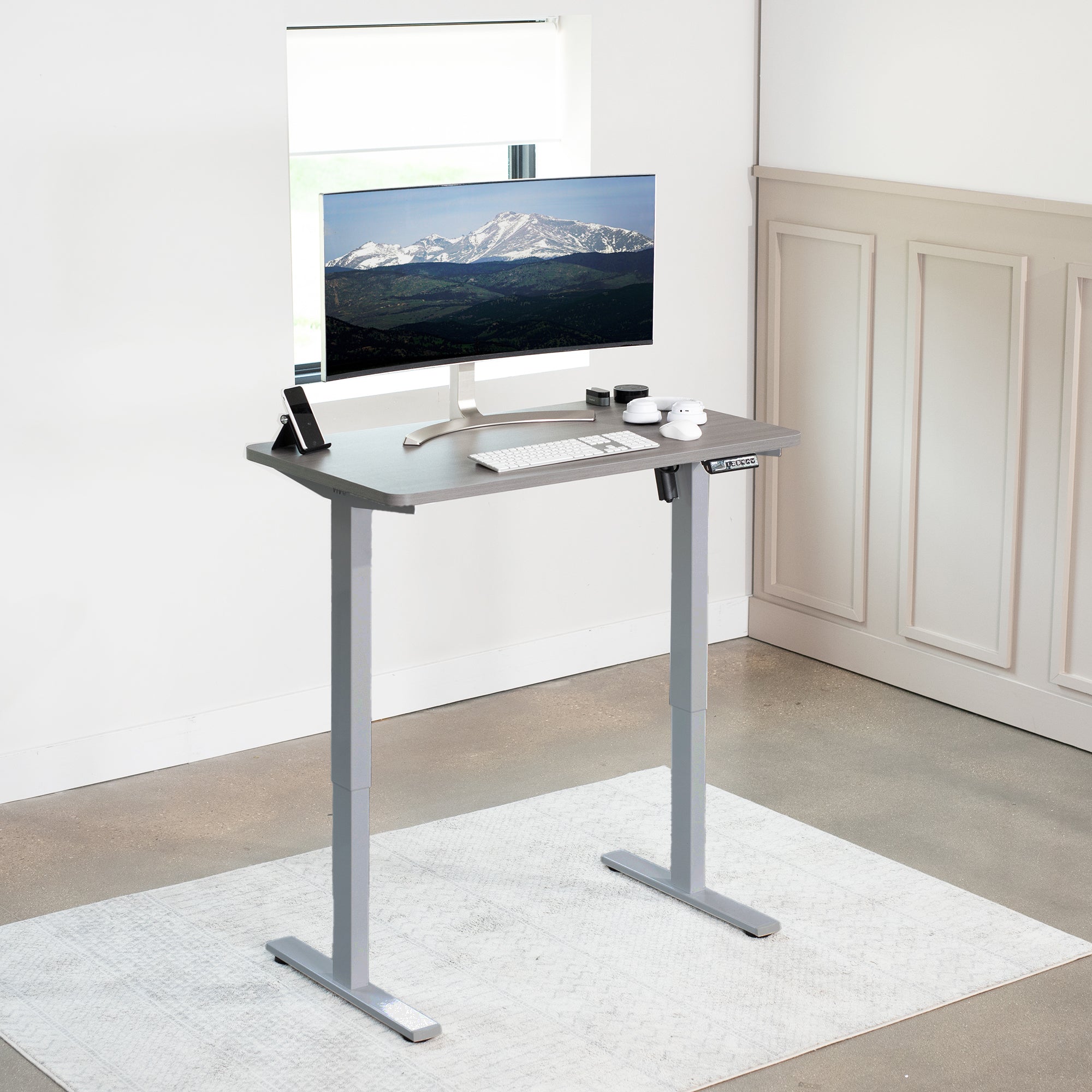 Sturdy ergonomic sit or stand active desk workstation with adjustable height using smart control panel.