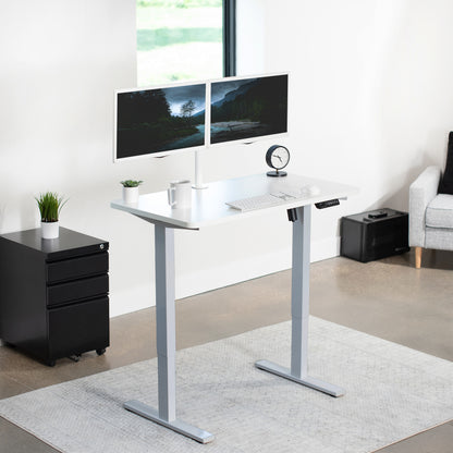 Sturdy ergonomic sit or stand active desk workstation with adjustable height using smart control panel.