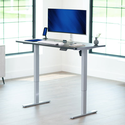 Sturdy ergonomic sit or stand active desk workstation with adjustable height using smart control panel.