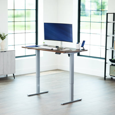 Sturdy ergonomic sit or stand active desk workstation with adjustable height using smart control panel.