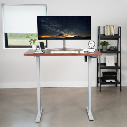 Sturdy ergonomic sit or stand active desk workstation with adjustable height using smart control panel.