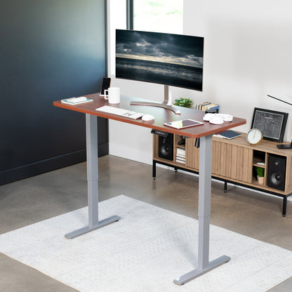 Sturdy ergonomic sit or stand active desk workstation with adjustable height using smart control panel.