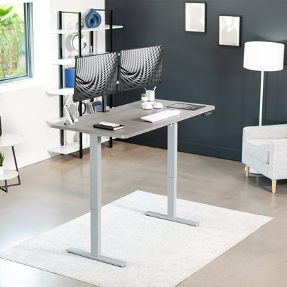 Sturdy ergonomic sit or stand active desk workstation with adjustable height using smart control panel.