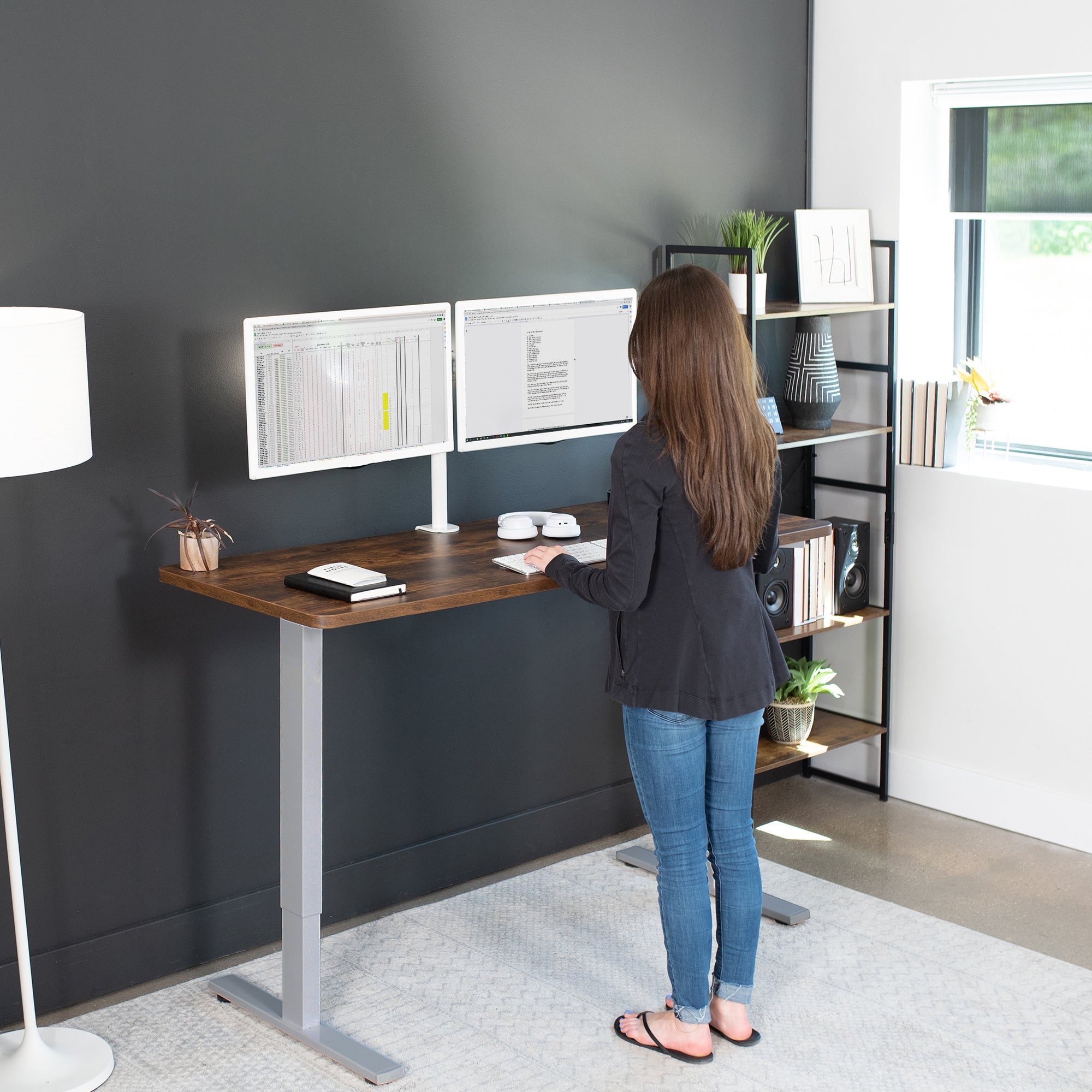 Rustic sturdy ergonomic sit or stand active desk workstation with adjustable height using smart control panel.