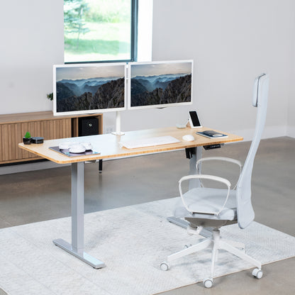 Sturdy real bamboo ergonomic sit or stand active desk workstation with adjustable height using smart control panel.