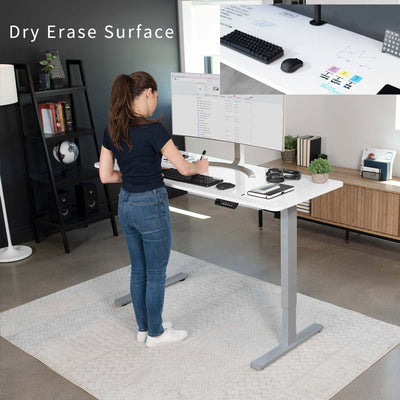 Dry erase sturdy ergonomic sit or stand active desk workstation with adjustable height using smart control panel.