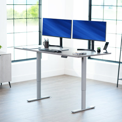 Large sturdy sit or stand modern desk with electric height adjustment options.