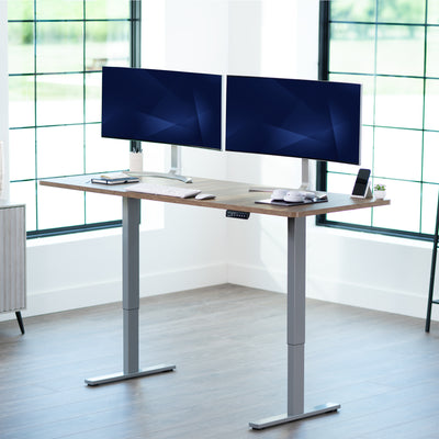 Large sturdy sit or stand modern desk with electric height adjustment options.