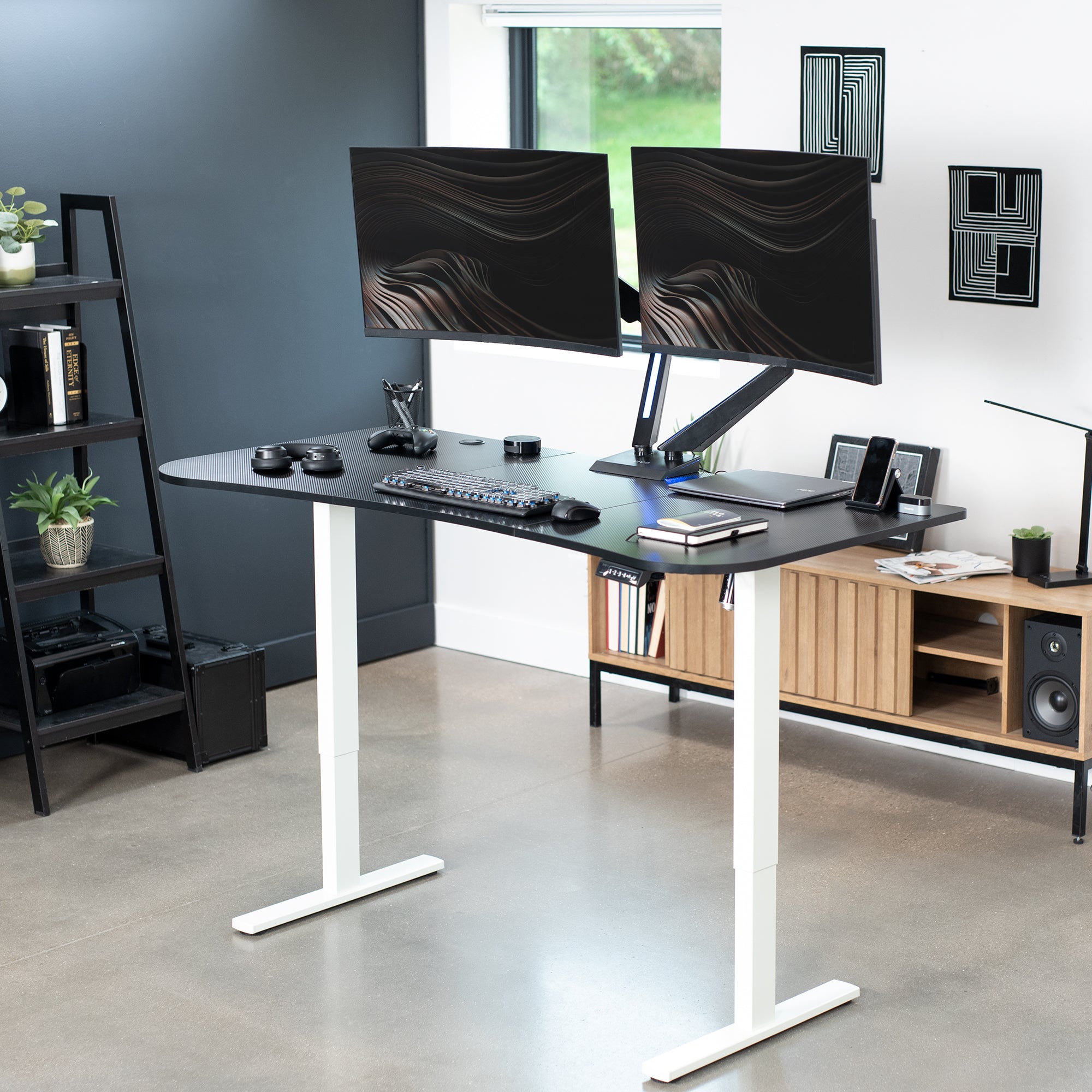 Sit to stand height adjustable electric desk with push button memory controller for ergonomic office workstation.