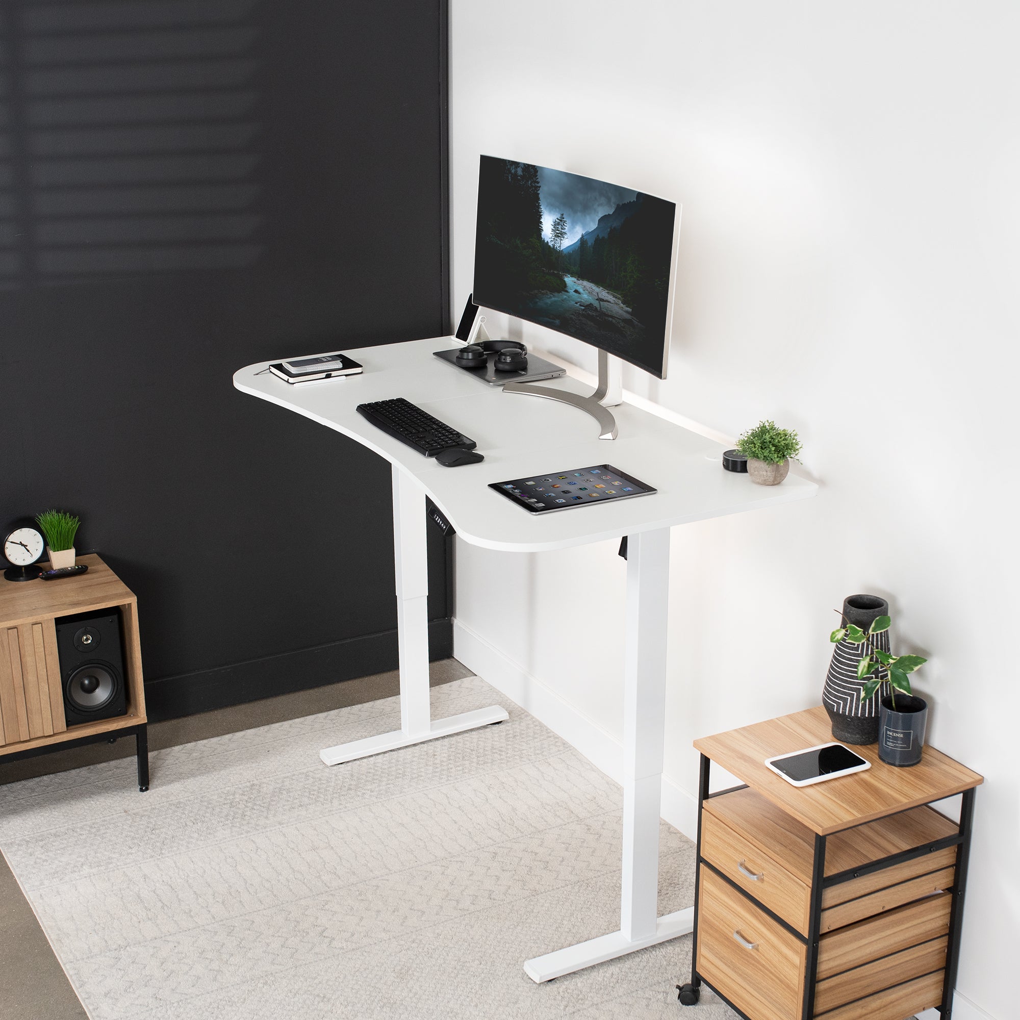 Sit to stand height adjustable electric desk with push button memory controller for ergonomic office workstation.