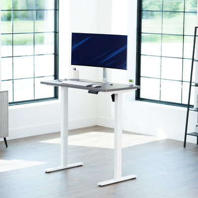 Sturdy ergonomic sit or stand active desk workstation with adjustable height using smart control panel.