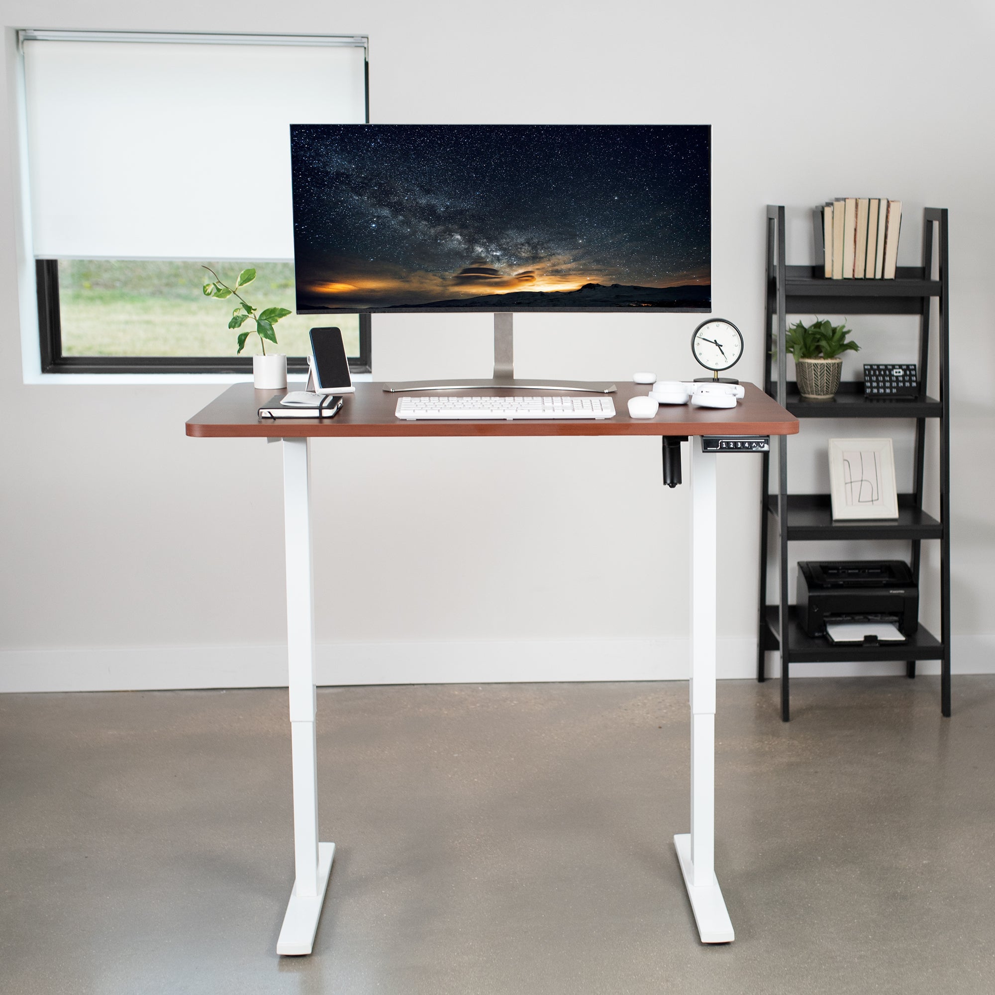 Sturdy ergonomic sit or stand active desk workstation with adjustable height using smart control panel.