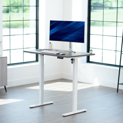Sturdy ergonomic sit or stand active desk workstation with adjustable height using smart control panel.