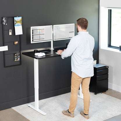 Sturdy ergonomic sit or stand active desk workstation with adjustable height using smart control panel.