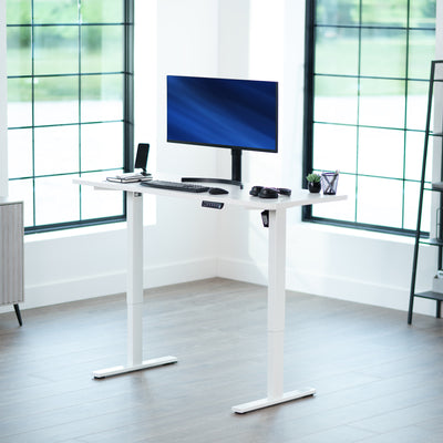 Sturdy ergonomic sit or stand active desk workstation with adjustable height using smart control panel.