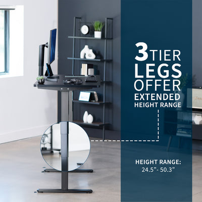 Black adjustable desk with a 3-tier leg design in an office setting