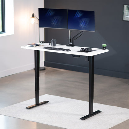 Heavy-duty electric height adjustable desktop workstation for active sit or stand efficient workspace.