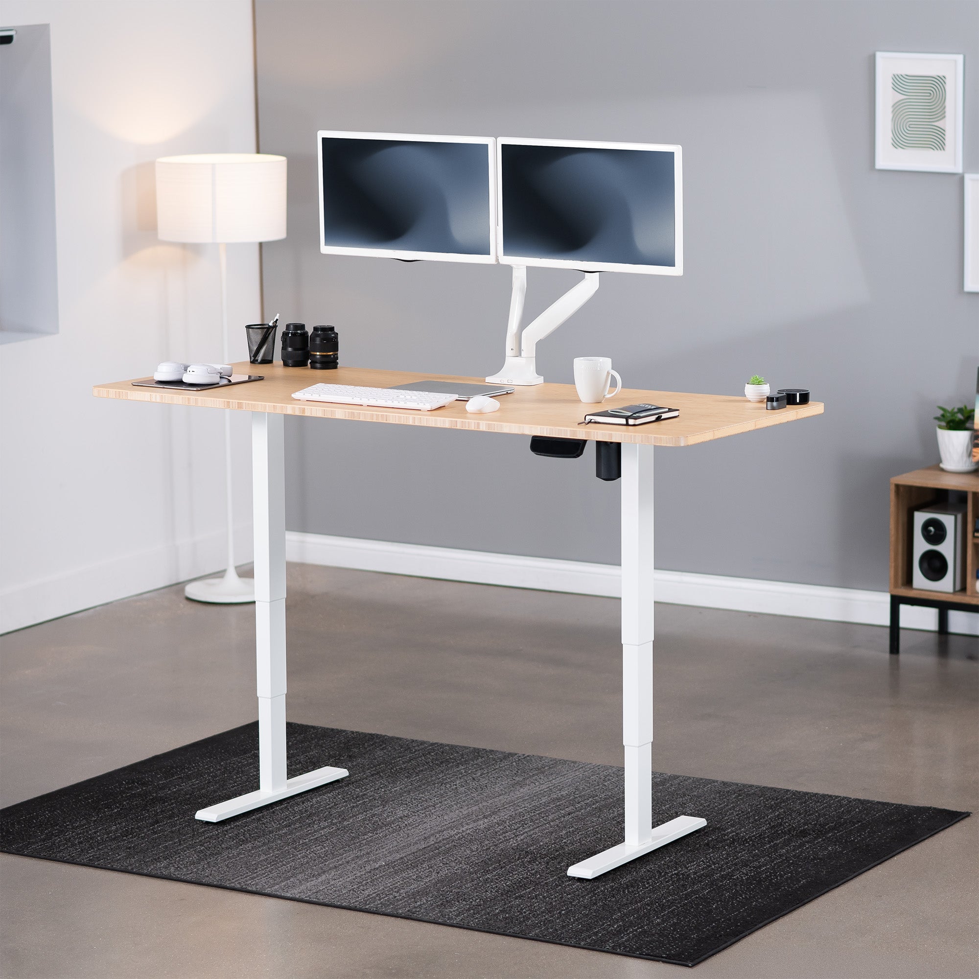 Heavy-duty electric height adjustable desktop workstation for active sit or stand efficient workspace.