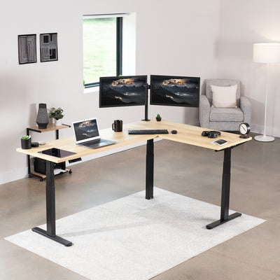 Large electric heavy-duty corner desk workstation for modern office workspaces.