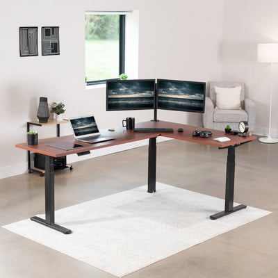 Large electric heavy-duty corner desk workstation for modern office workspaces.