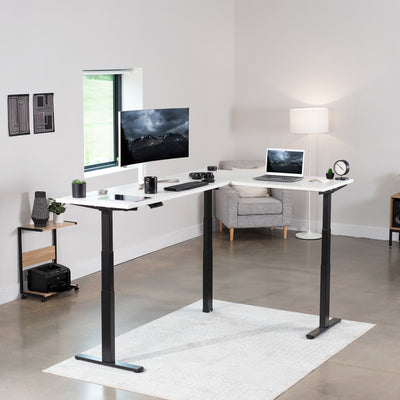 Large electric heavy-duty corner desk workstation for modern office workspaces.