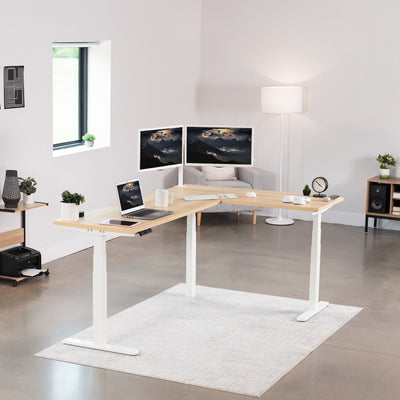 Large electric heavy-duty corner desk workstation for modern office workspaces.