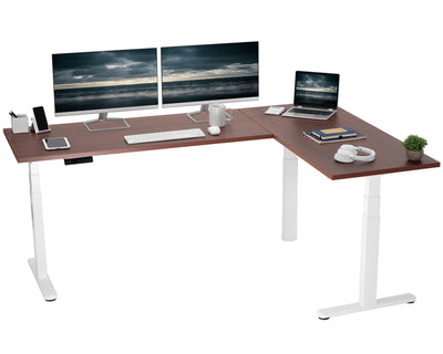 Large electric heavy-duty corner desk workstation for modern office workspaces.