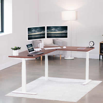 Large electric heavy-duty corner desk workstation for modern office workspaces.