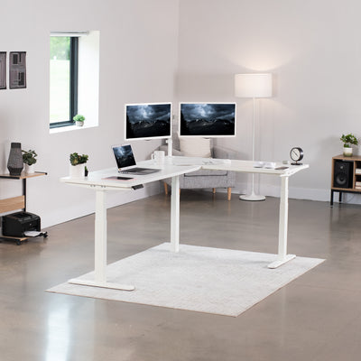 Large electric heavy-duty corner desk workstation for modern office workspaces.