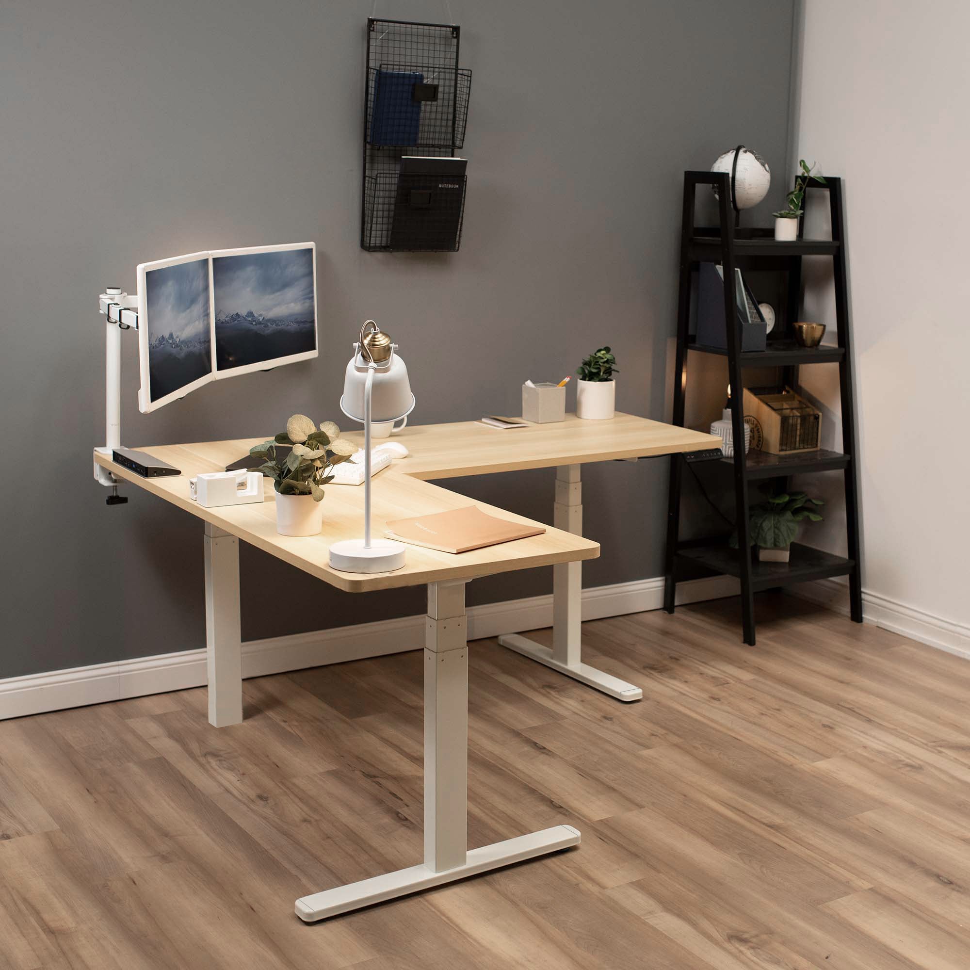 Heavy-duty electric height adjustable corner desk workstation for active sit or stand efficient workspace.