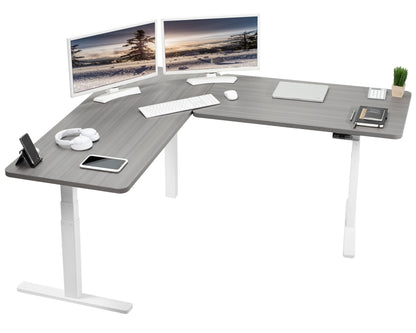 Heavy-duty electric height adjustable corner desk workstation for active sit or stand efficient workspace.