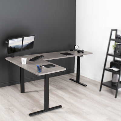 Large sturdy height adjustable corner desk workstation with memory controller.