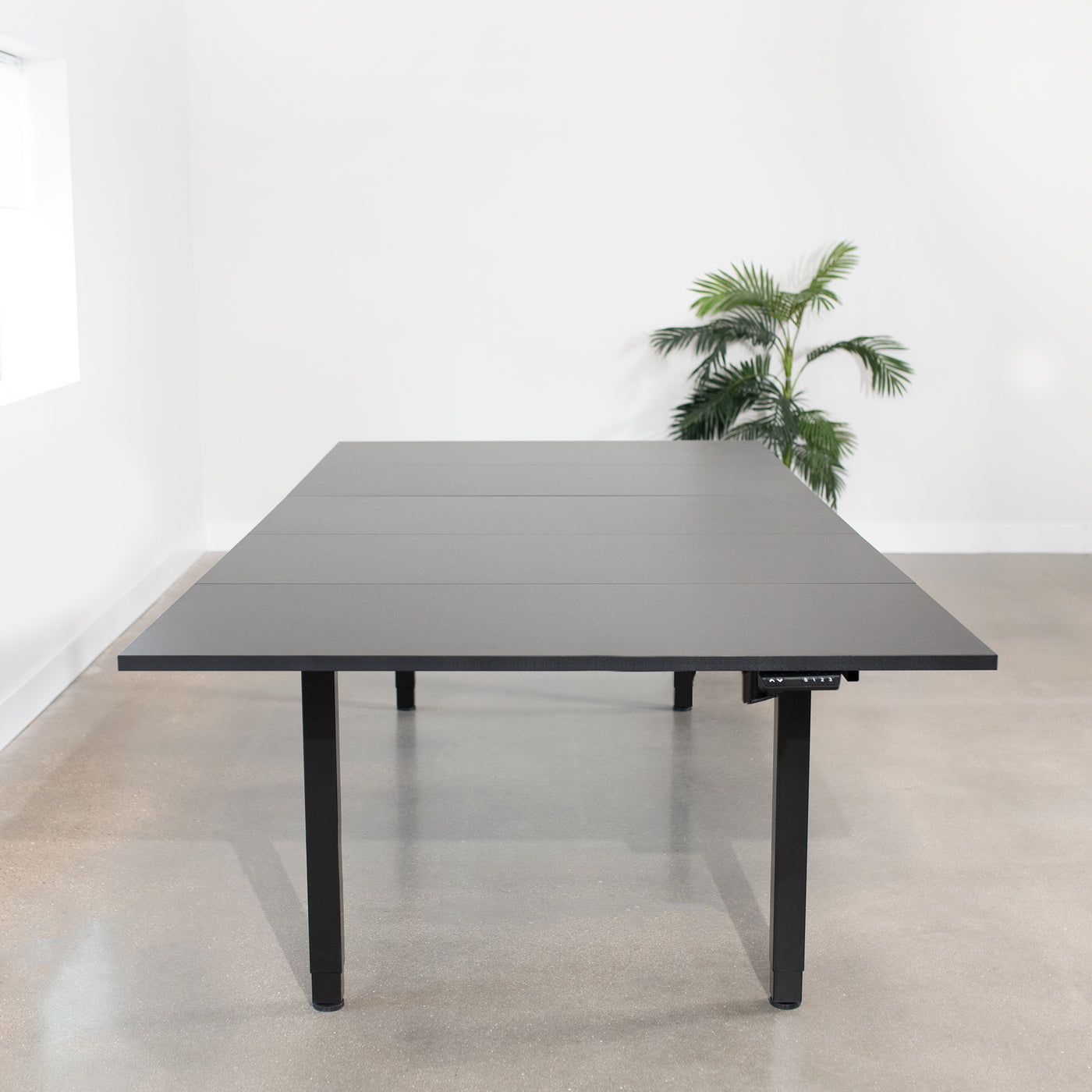 118" x 55" Dual Motor Electric 4-Leg Desk with Square Corner Top is an extra large height adjustable desk perfect for a conference room table or project workstation setup.