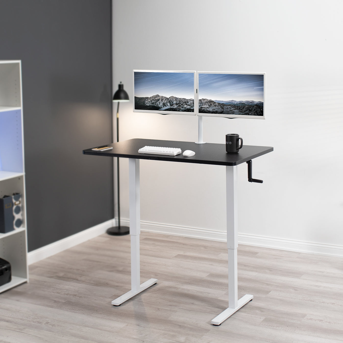 Manual hand crank height adjustable desk for sit or stand active workstation.