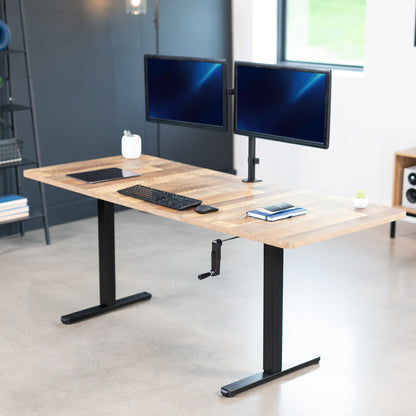 Wide surface sturdy sit or stand active workstation with adjustable height using manual hand crank.