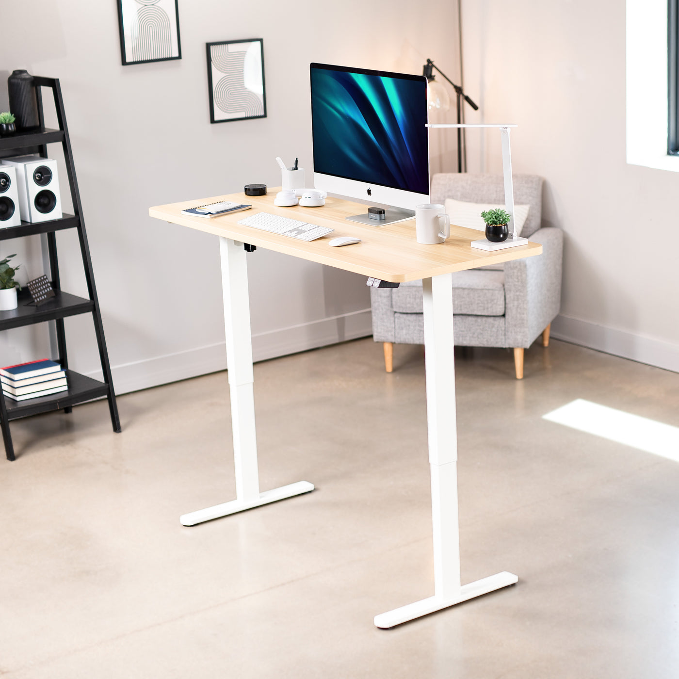 Heavy-duty electric height adjustable desktop workstation for active sit or stand efficient workspace.