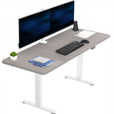 Gray desk with computer setup including monitors, keyboard, mouse, and stationery on a white background