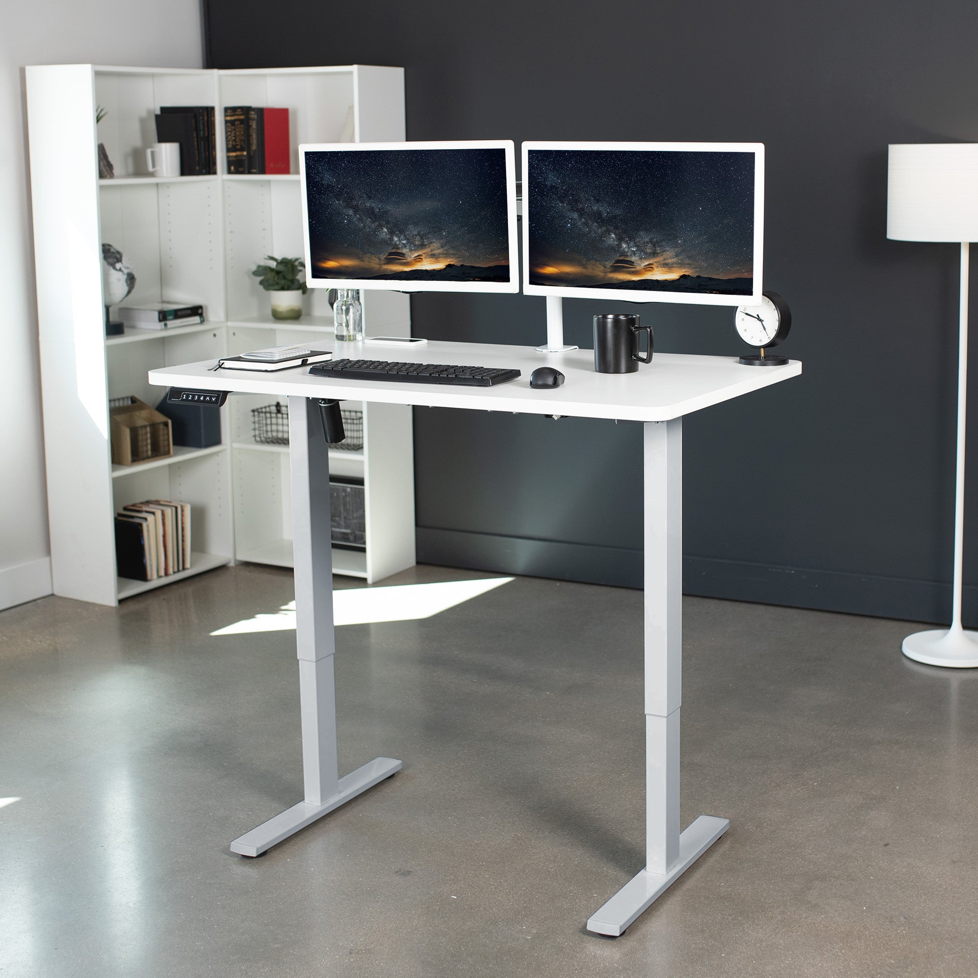 Sturdy ergonomic sit or stand active desk workstation with adjustable height using smart control panel.