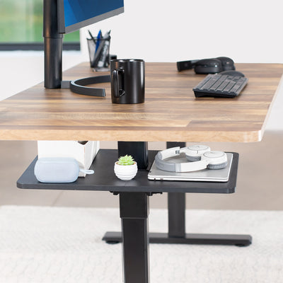 Under desk floating shelf platform that clamps onto desk leg. Provides convenient hidden storage that adjusts with your sit to stand desk.