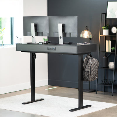 Black desk drawers on black desk in a modern home office. 