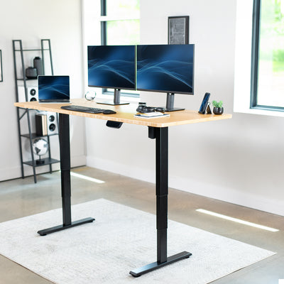 Durable sit or stand desktop workstation with wide surface.