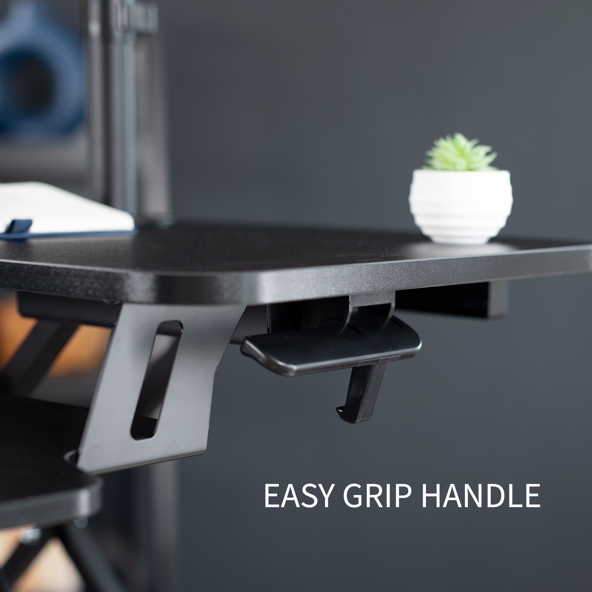 Sturdy height adjustable desk converter with articulating dual monitor mount.