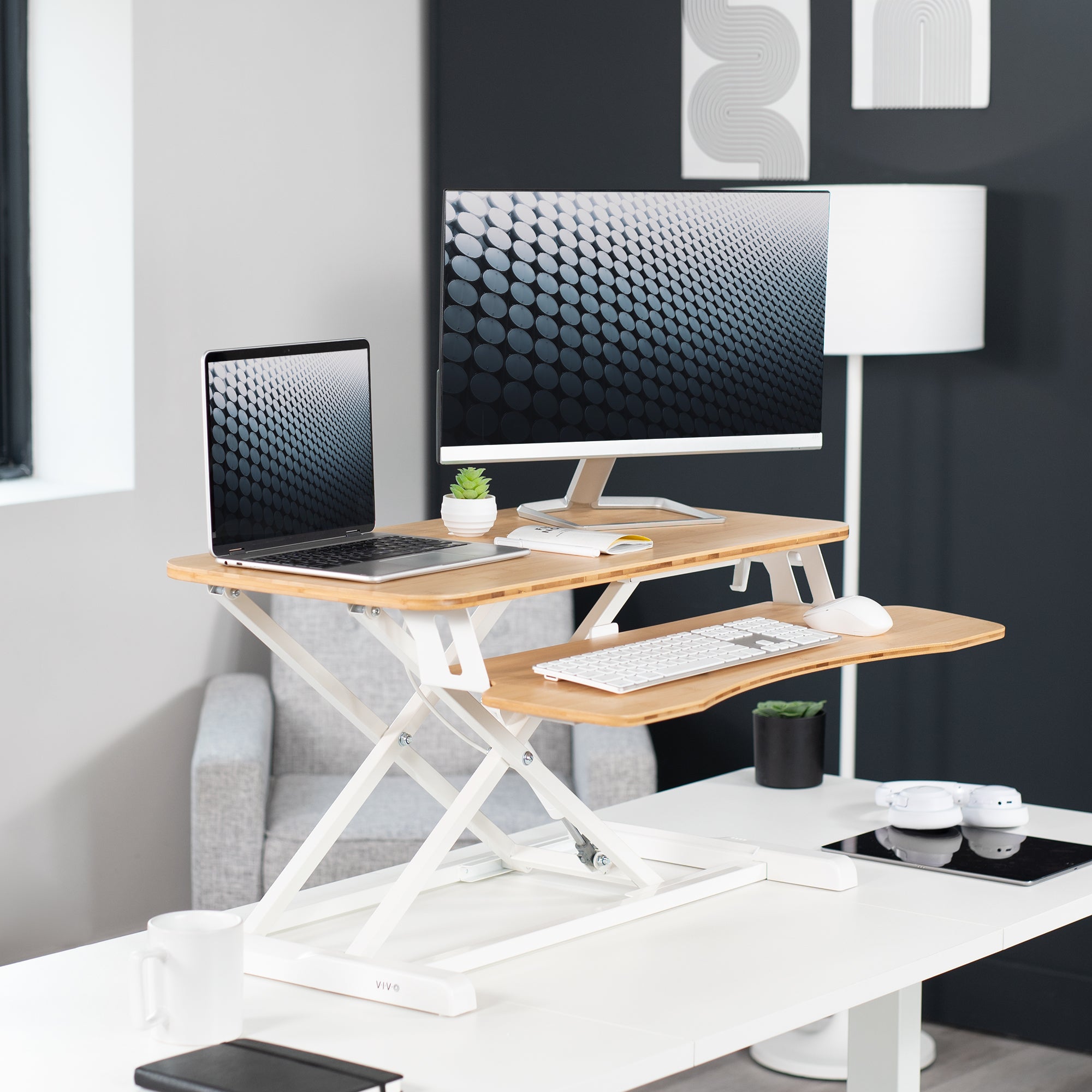 Sturdy height adjustable 2-tiered desk riser for ergonomic office workstation.