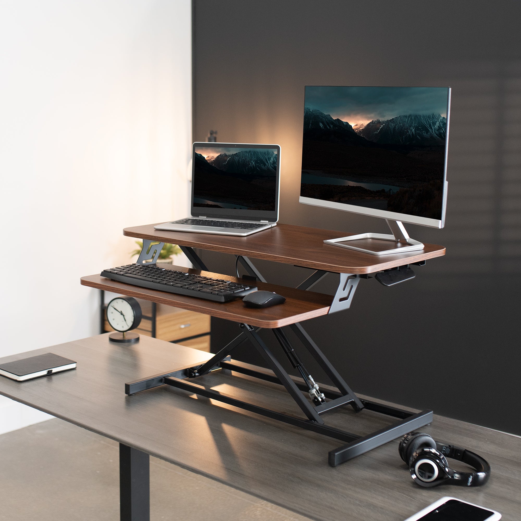 Heavy-duty height adjustable desk converter monitor riser with 2 tiers.