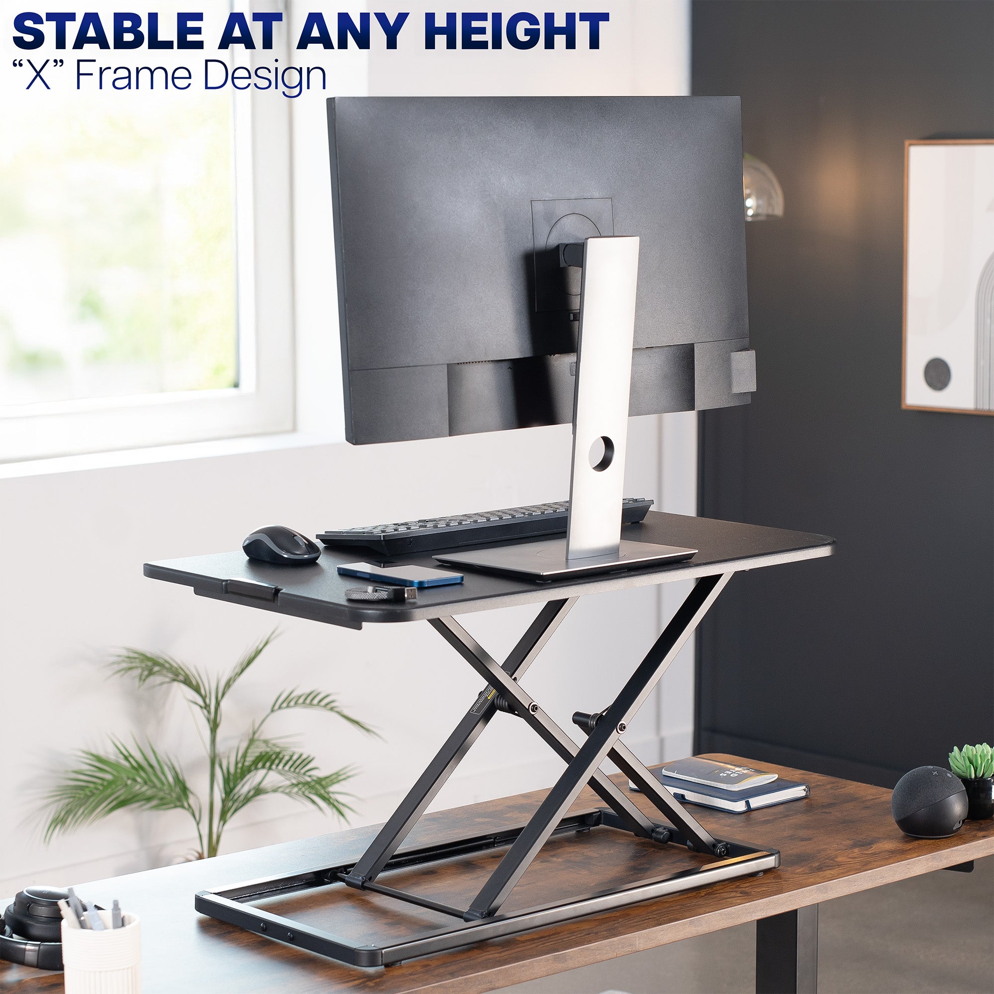 Heavy-duty height adjustable desk converter monitor riser.