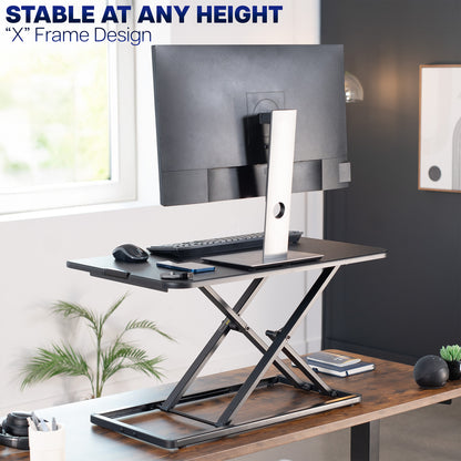 Heavy-duty height adjustable desk converter monitor riser.