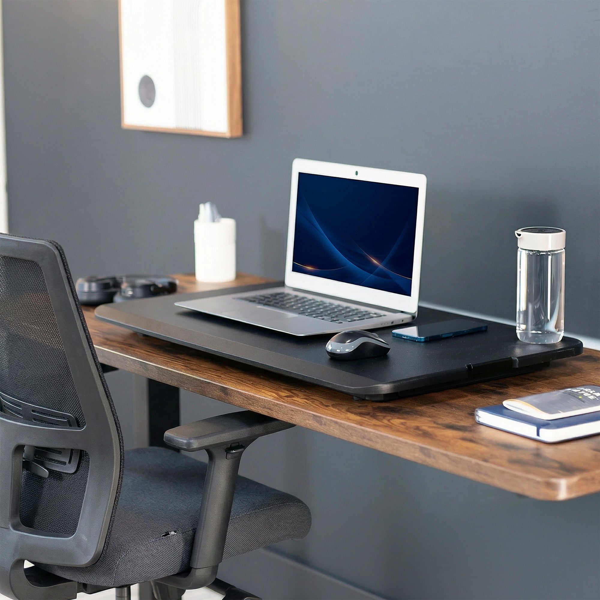 Heavy-duty height adjustable desk converter monitor riser.