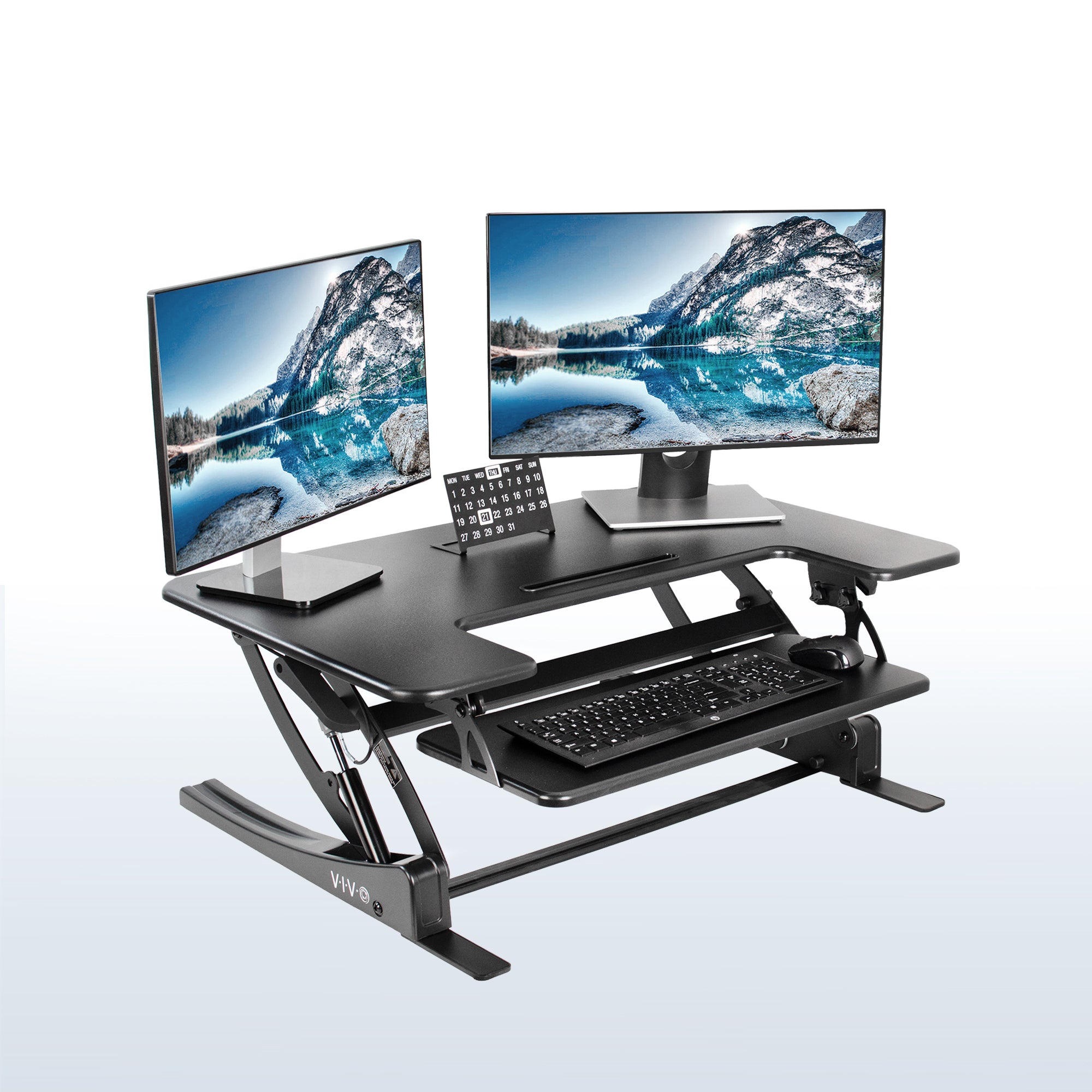 Heavy-duty height adjustable desk converter monitor riser with two tiers.
