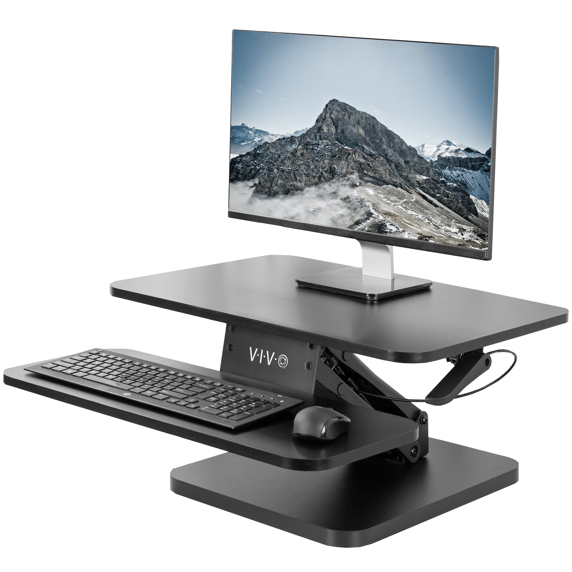 Sit stand desk converter sits on top of current desk and raises and lowers for a comfortable viewing and typing experience.