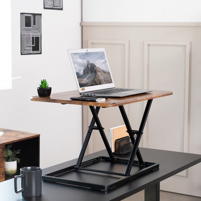 Ergonomic height adjustable rustic desk converter monitor riser.